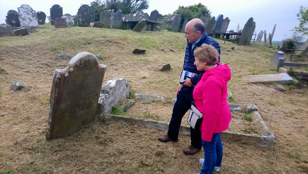 Looking-at-a-headstone Looking at a headstone