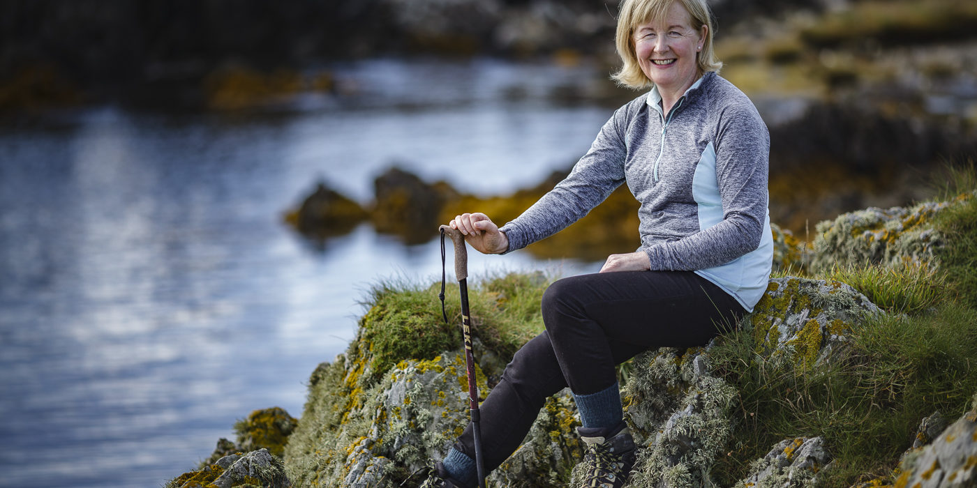 Brigid Watson Sitting on the rocks at Knockinelder Bay