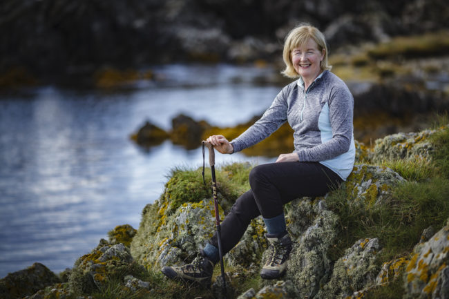 Brigid Watson Sitting on the rocks at Knockinelder Bay