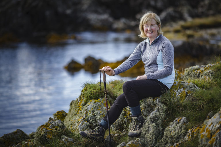 Brigid Watson Sitting on the rocks at Knockinelder Bay